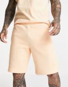adidas Originals - adicolor - Bløde shorts i bleg orange