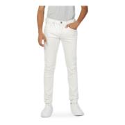 Hvide ensfarvede jeans med lynlås og knaplukning