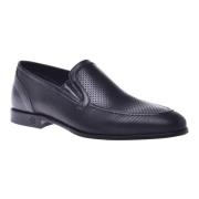 Loafer in black perforated calfskin